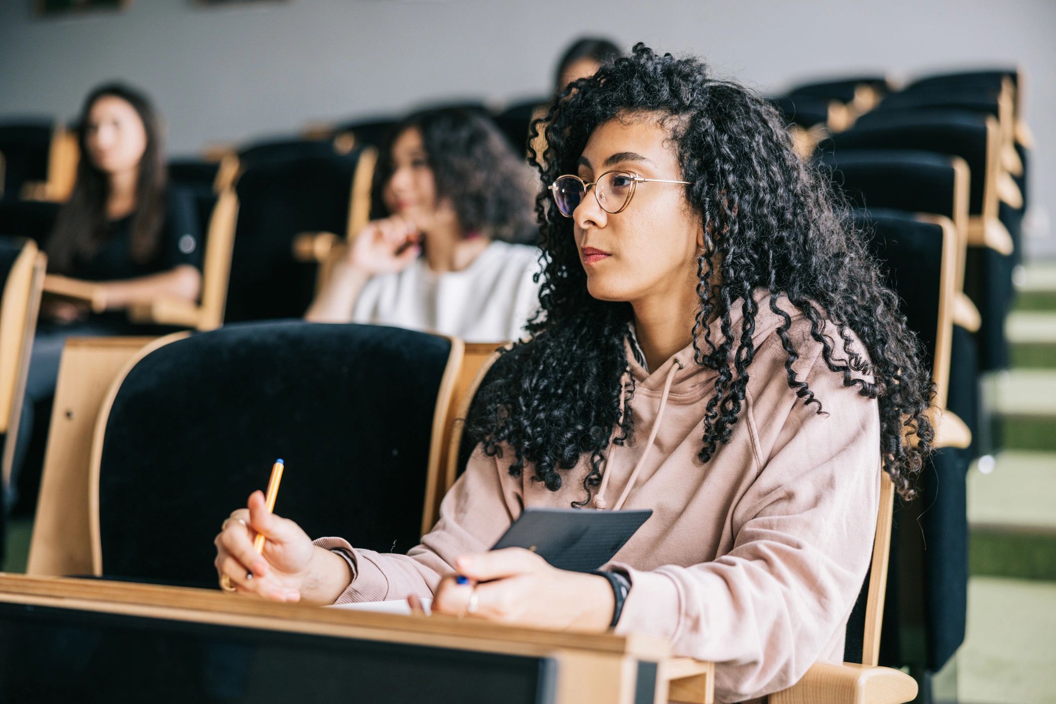 Young woman listening to a university lecture