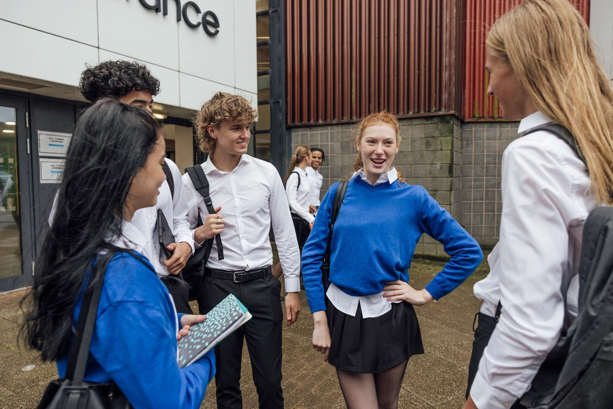 Students meeting outside a school building