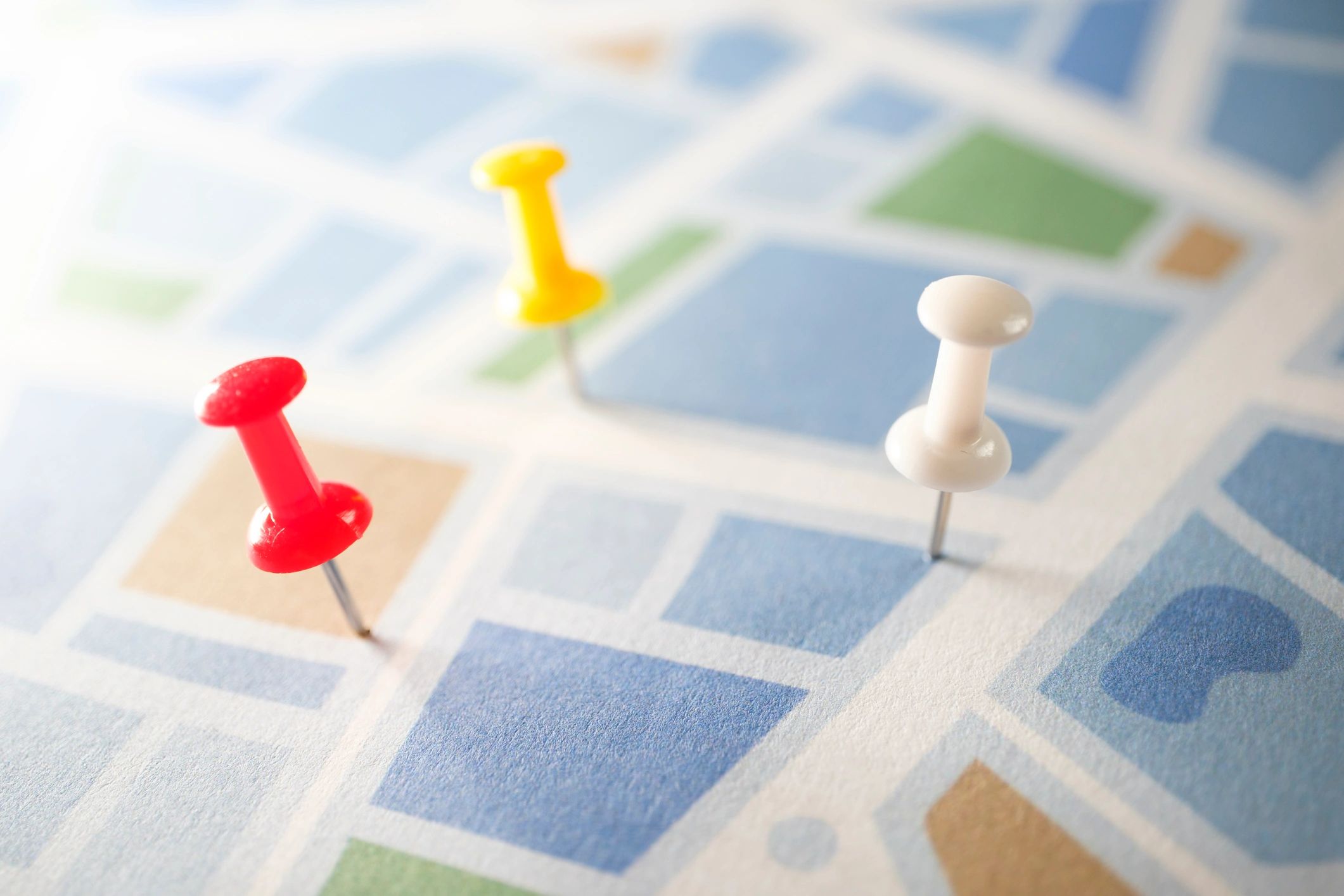 Thumbtacks on a road map representing planning