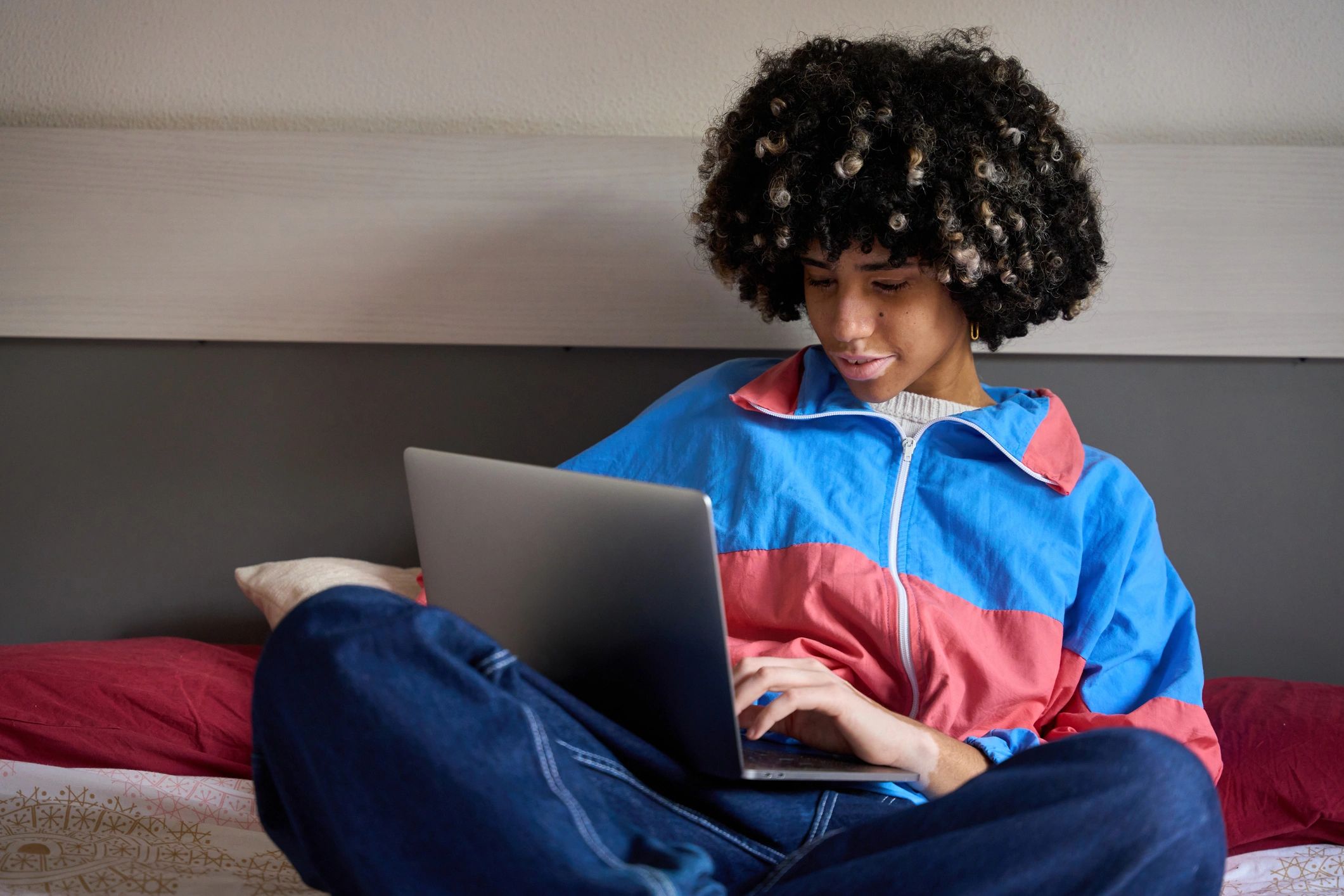 Student studying on a laptop at home